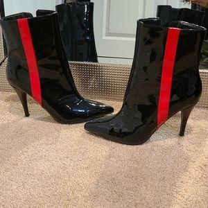 Black patent boots with red stripes